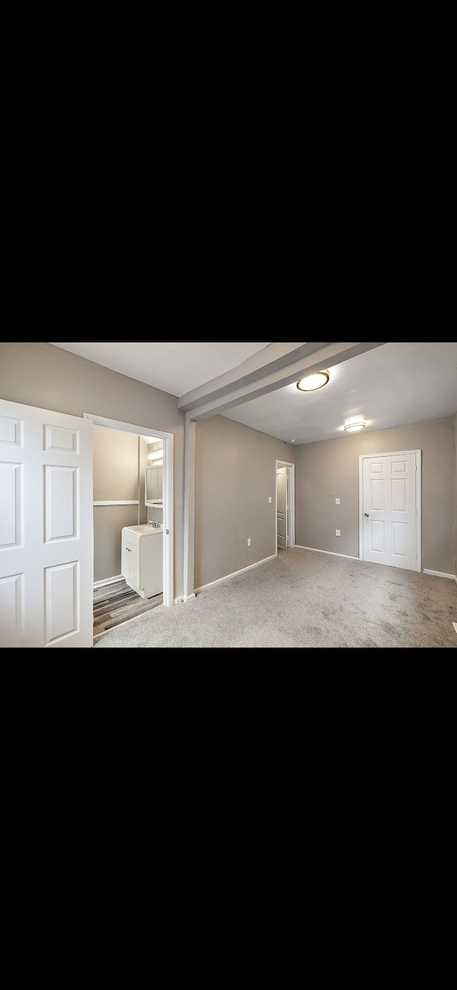 unfurnished bedroom featuring carpet