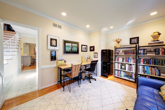 office area featuring crown molding and light hardwood / wood-style floors