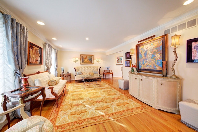 sitting room featuring hardwood / wood-style flooring and ornamental molding