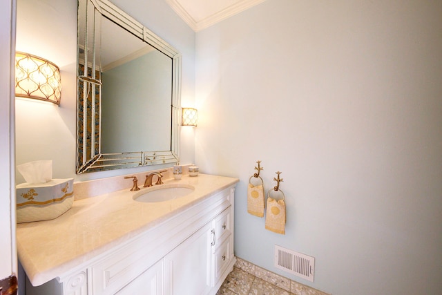 bathroom with ornamental molding and vanity