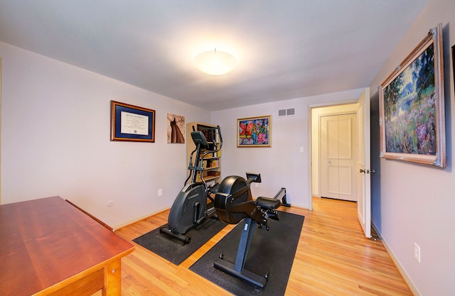 exercise area featuring hardwood / wood-style floors