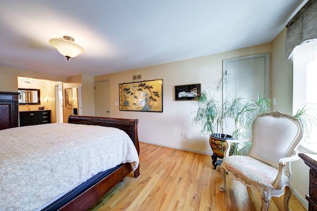 bedroom with light hardwood / wood-style floors