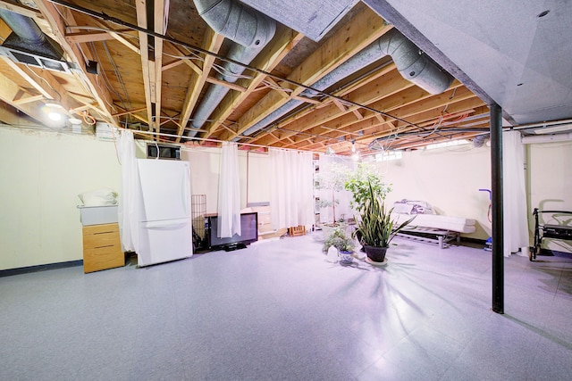 basement with white fridge