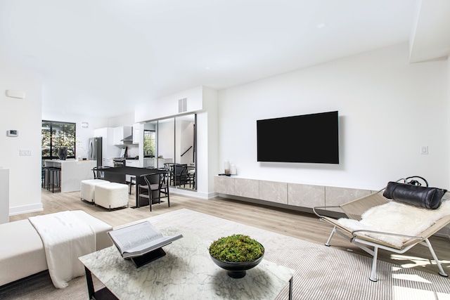 living room with light hardwood / wood-style flooring