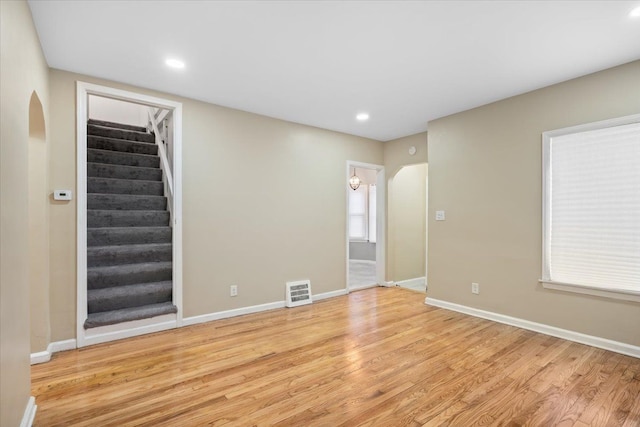 unfurnished room with light wood-type flooring