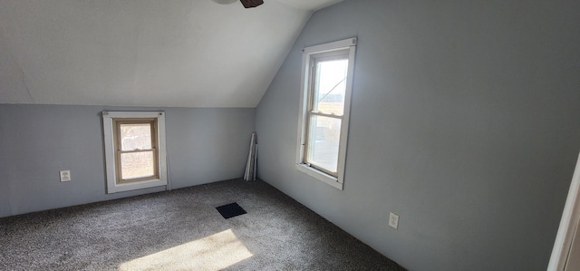 additional living space with ceiling fan, lofted ceiling, and carpet floors