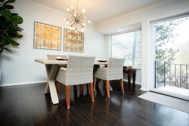 dining space featuring crown molding, dark wood-type flooring, and a chandelier