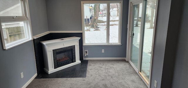 unfurnished living room featuring carpet floors