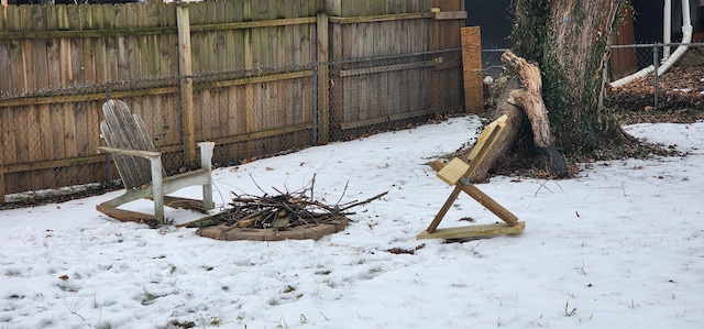 view of yard covered in snow