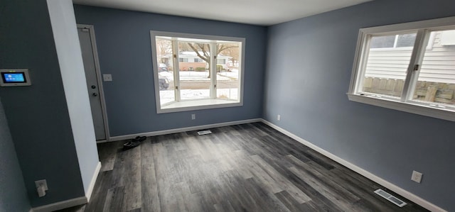 spare room with dark hardwood / wood-style floors