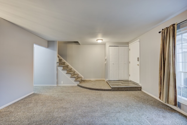 entrance foyer featuring carpet flooring