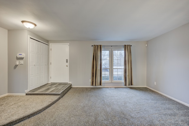 view of carpeted foyer