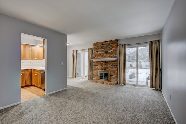 unfurnished living room with light colored carpet and a fireplace