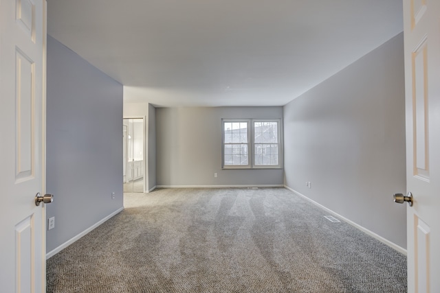 spare room with light carpet