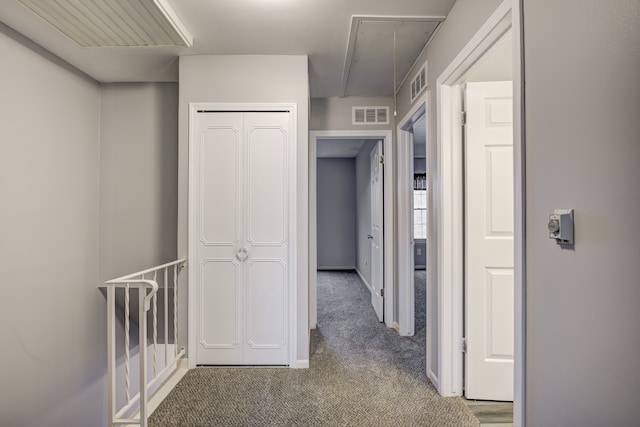 hallway with carpet flooring