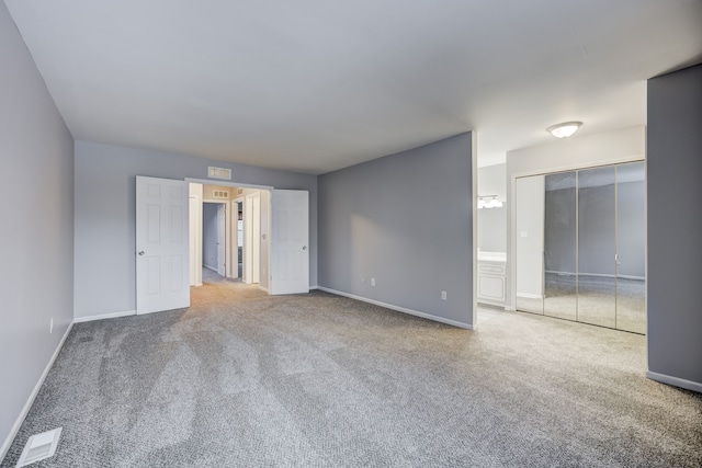 interior space with carpet flooring and a closet