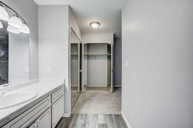 bathroom featuring vanity and hardwood / wood-style floors