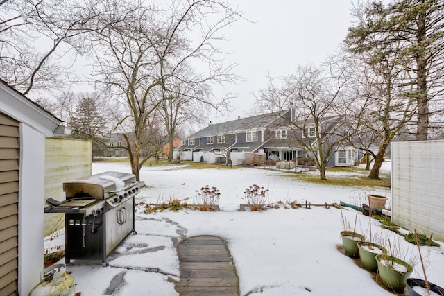 view of yard layered in snow