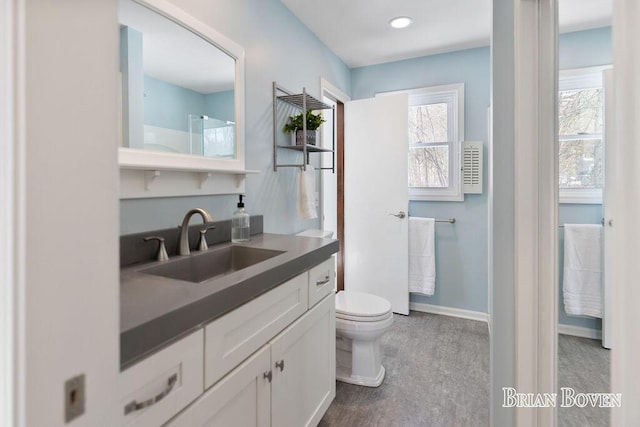 bathroom featuring vanity and toilet