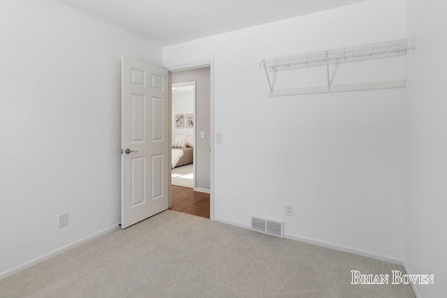 empty room with light colored carpet