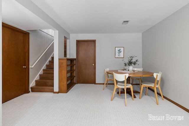 view of carpeted dining area