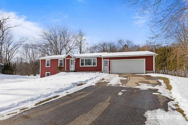 ranch-style home featuring a garage