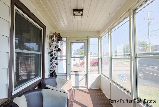 sunroom / solarium featuring wooden ceiling