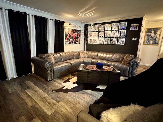 home theater featuring hardwood / wood-style flooring and ornamental molding