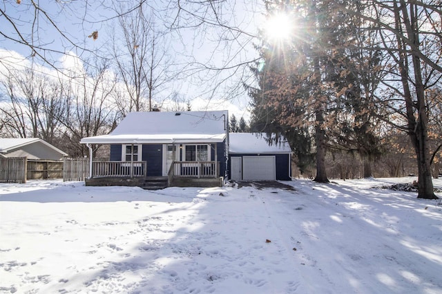 view of front of property featuring a garage and covered porch