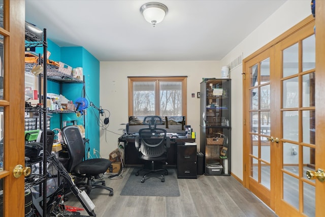 office space with french doors and hardwood / wood-style flooring