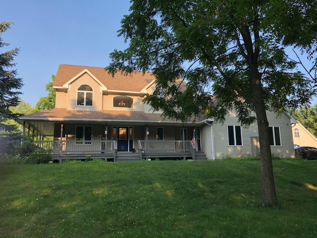 farmhouse with covered porch and a front lawn