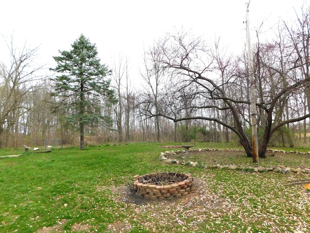 view of yard with an outdoor fire pit