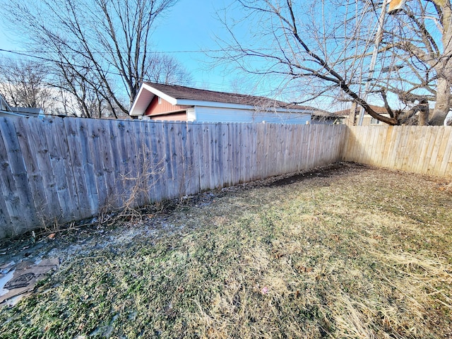 view of yard with a fenced backyard