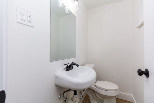 bathroom with toilet and sink