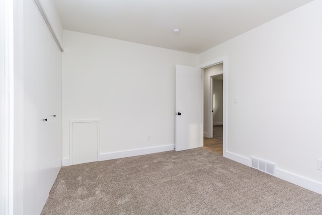 unfurnished room with carpet floors