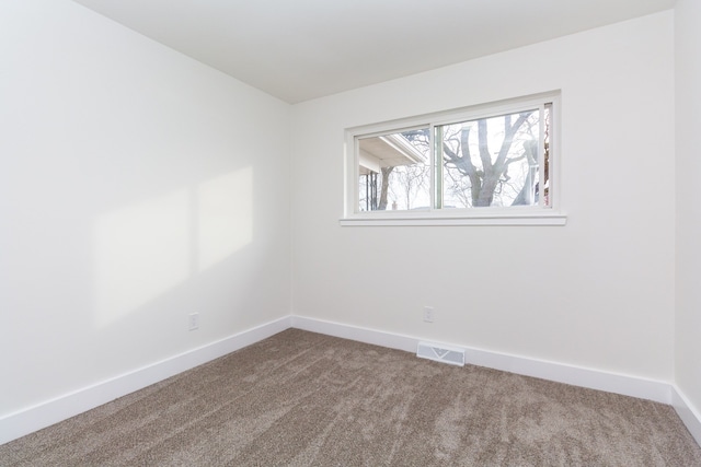 spare room featuring carpet