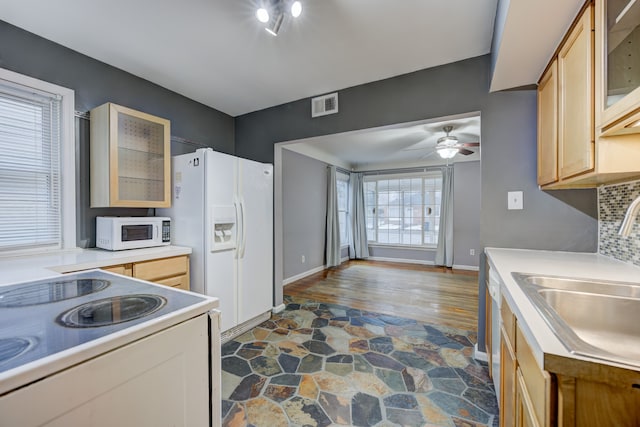 kitchen with ceiling fan, white appliances, sink, and light brown cabinets