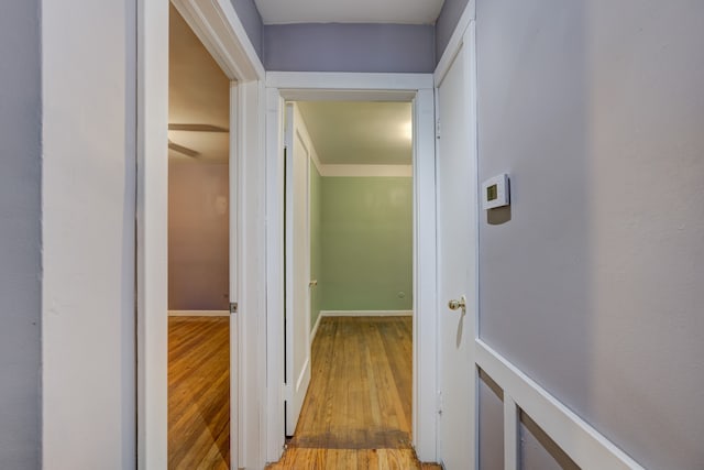 corridor with light hardwood / wood-style flooring