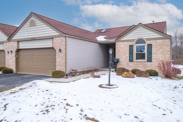 single story home featuring a garage