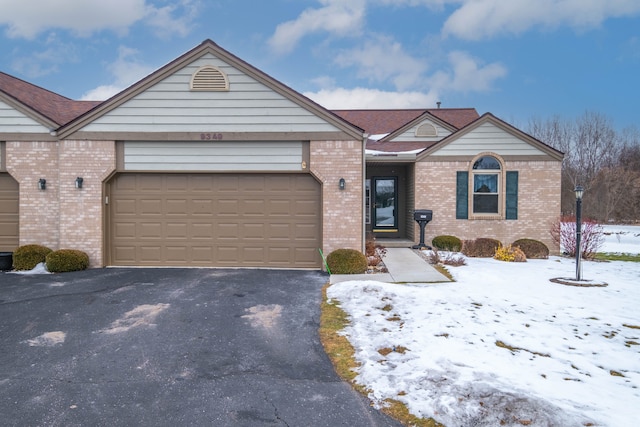 ranch-style home with a garage