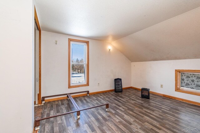 1613 Bay St, Saginaw, MI 48602 - additional living space featuring wood finished floors and vaulted ceiling