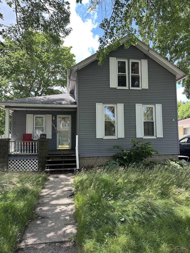 1613 Bay St, Saginaw, MI 48602 - view of front of home featuring a porch