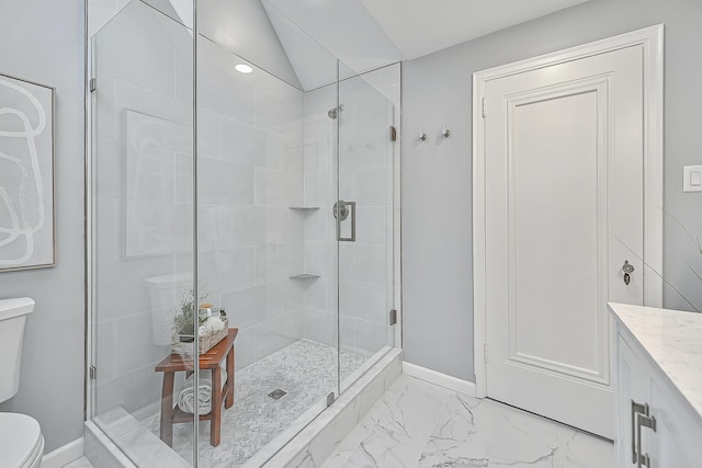 bathroom featuring an enclosed shower, vanity, lofted ceiling, and toilet