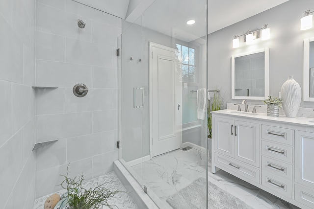 bathroom with vanity and a shower with shower door