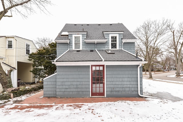 view of snow covered house