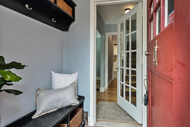 mudroom with wood-type flooring