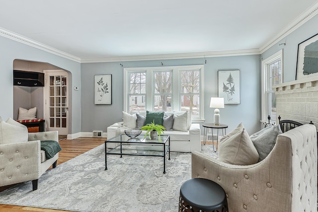 living room featuring ornamental molding and hardwood / wood-style floors