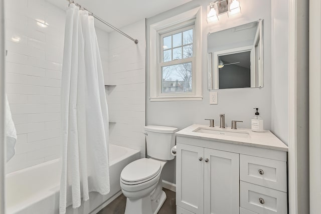 full bathroom with shower / bath combination with curtain, vanity, and toilet