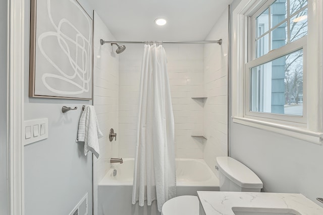 full bathroom with toilet, vanity, and shower / bathtub combination with curtain