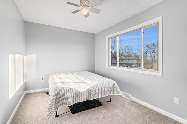 bedroom featuring ceiling fan and carpet floors